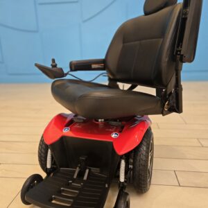 Red Pride Jazzy Select HD power chair with black captain’s seat, new batteries, and front footrest.