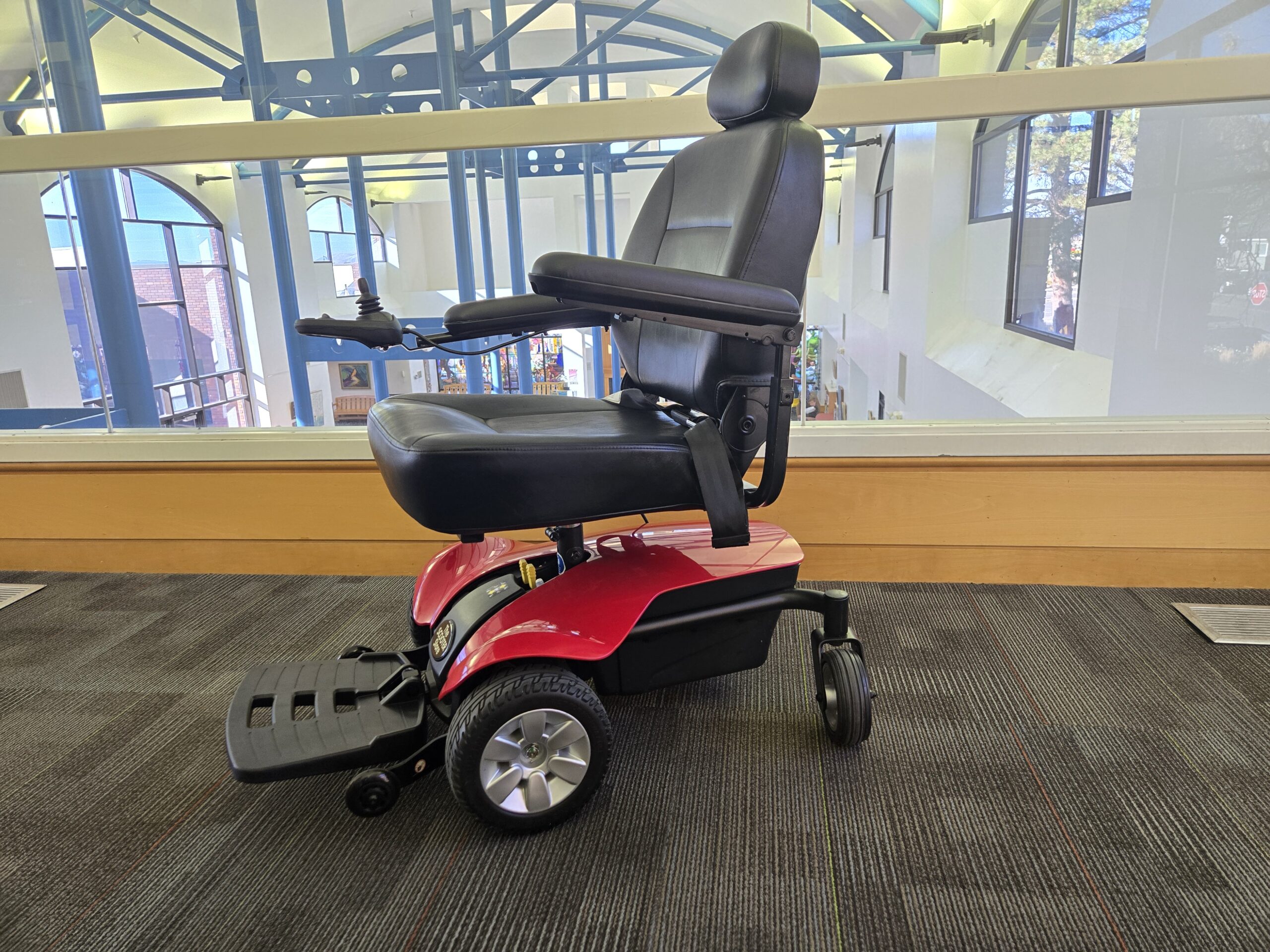 Cherry red Jazzy Select Elite (TSS-300 by The Scooter Store) front view with new batteries installed